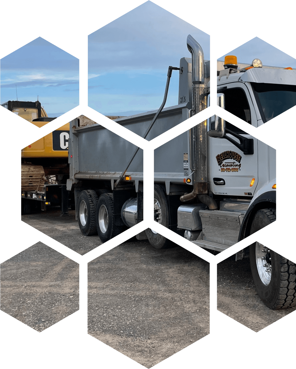 A low-bed float truck loaded with heavy equipment, ready for transport.